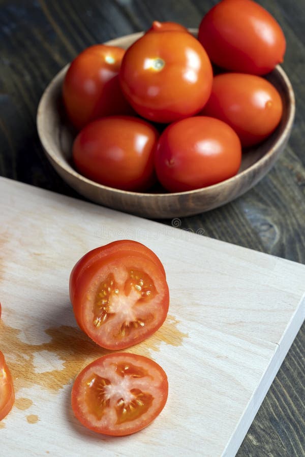 Delicious Fresh Tomato Cut into Chunks on the Table Stock Photo Image