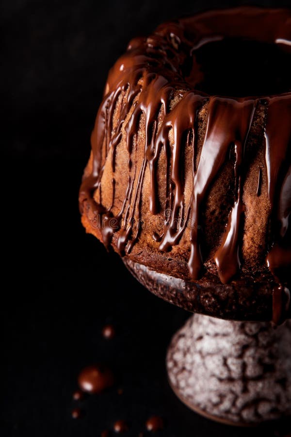 Delicious freshly baked pie with chocolate couverture on slate plate stock image Delicious freshly baked pie with chocolate couverture on slate plate stock image