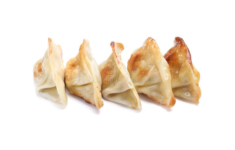 Delicious fried gyoza dumplings isolated on white fotos de archivo