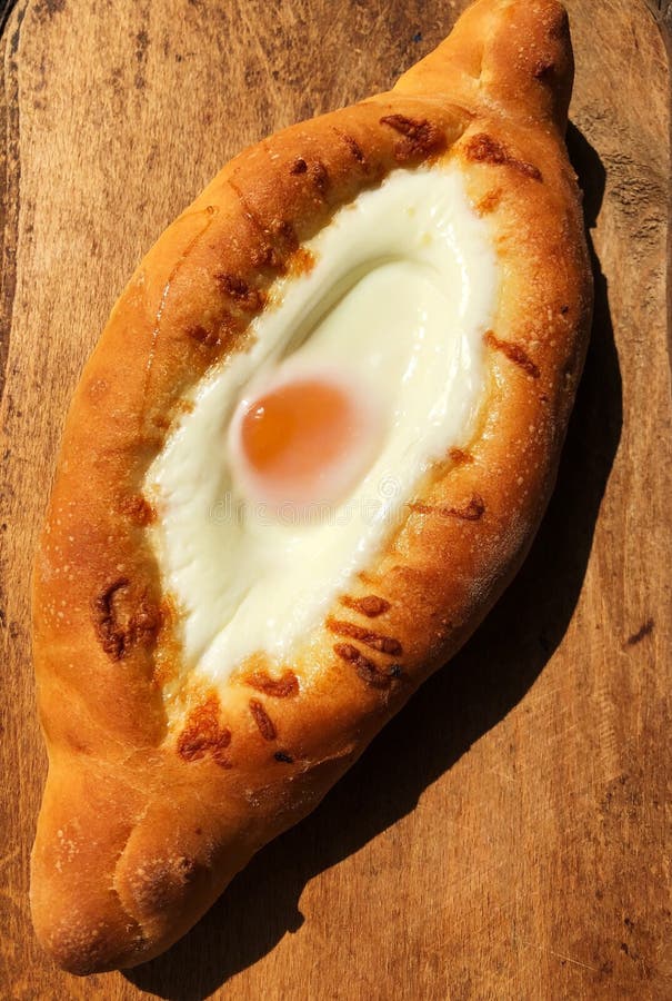 Delicious Georgian bread with egg and cheese stock image Delicious Georgian bread with egg and cheese stock image