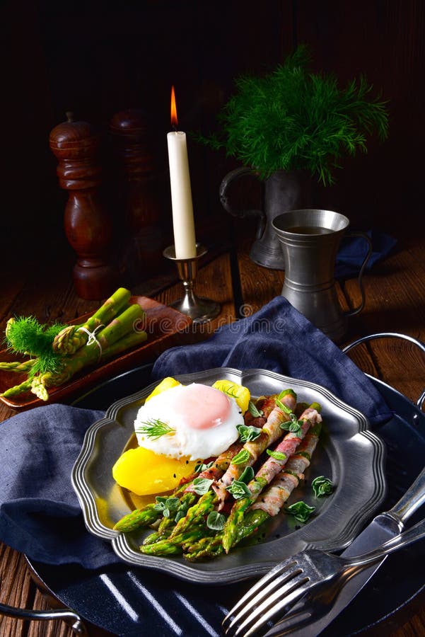 A Delicious Green Asparagus Wrapped in Bacon and Egg Stock Photo