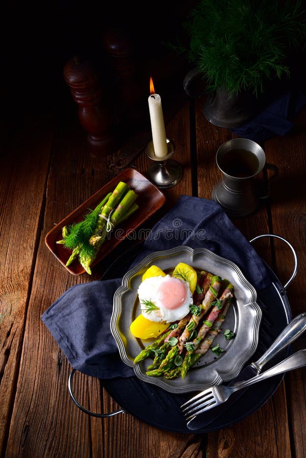 A delicious green asparagus wrapped in bacon and egg. Delicious green asparagus wrapped in bacon and egg stock photos A delicious green asparagus wrapped in bacon and egg. Delicious green asparagus wrapped in bacon and egg stock photos