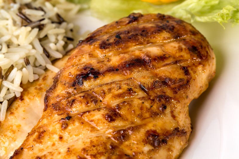 Delicious grilled chicken fillet with rice.