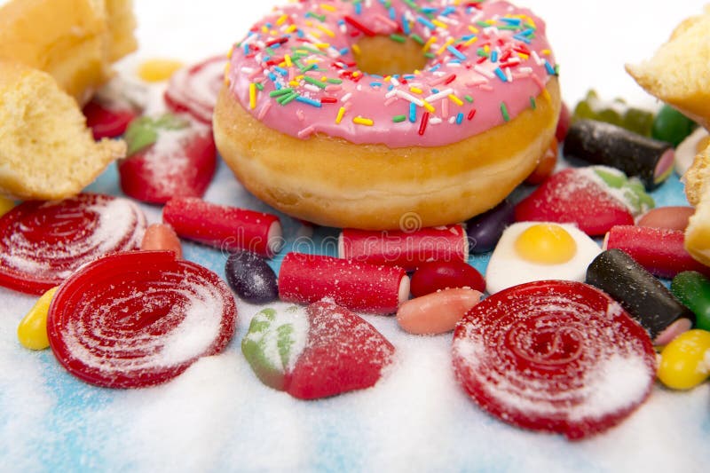 Delicious group of sweet sugar donut cakes and lots of gummy can