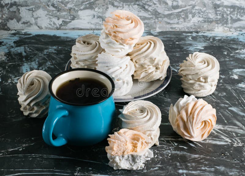 Delicious Homemade Marshmallow and Cup with Tea on Gray Background with