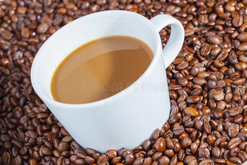Delicious Hot Coffee with Cream on Coffee Beans 2 Stock Photo Image