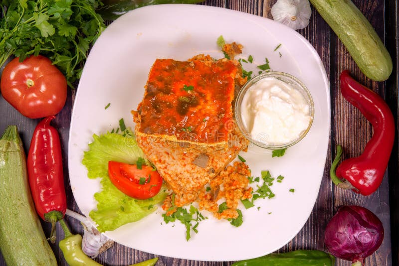 Delicious Lamb Pluck with Rice and Yogurt on a Plate on the Table Stock