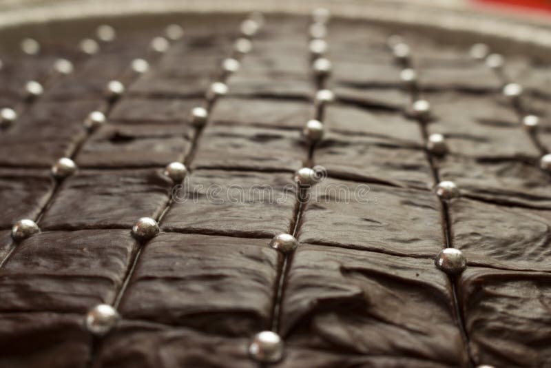 Delicious Looking Brown Chocolate Cake with Silver Sugar Balls Stock