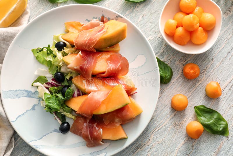 Delicious Melon Wrapped in Prosciutto on Plate Stock Photo Image of