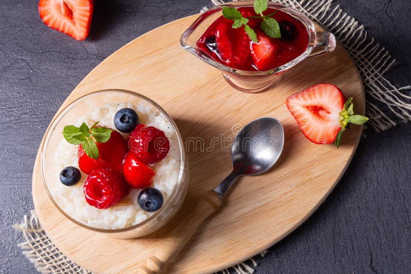 Delicious Milk Rice with Different Berries and Red Fruit Jelly Stock