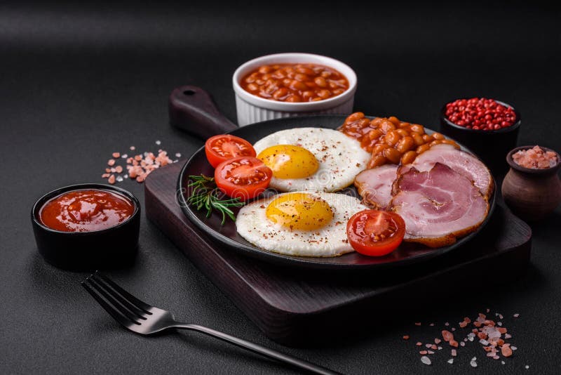 Delicious Nutritious English Breakfast with Fried Eggs and Tomatoes