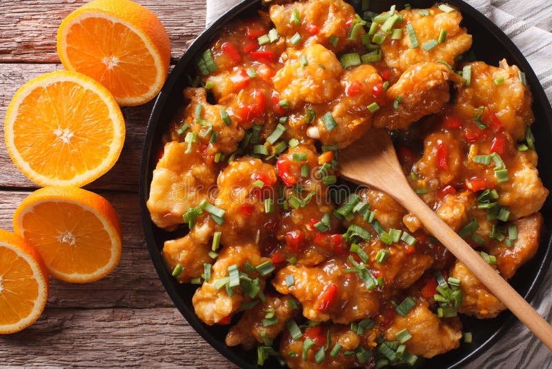 Delicious Orange Chicken Fillets Closeup on a Plate. Horizontal Stock