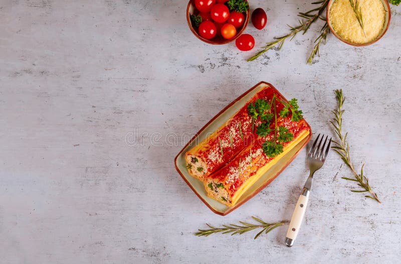 Delicious pasta cannelloni stuffed with ricotta and spinach stock images Delicious pasta cannelloni stuffed with ricotta and spinach stock images