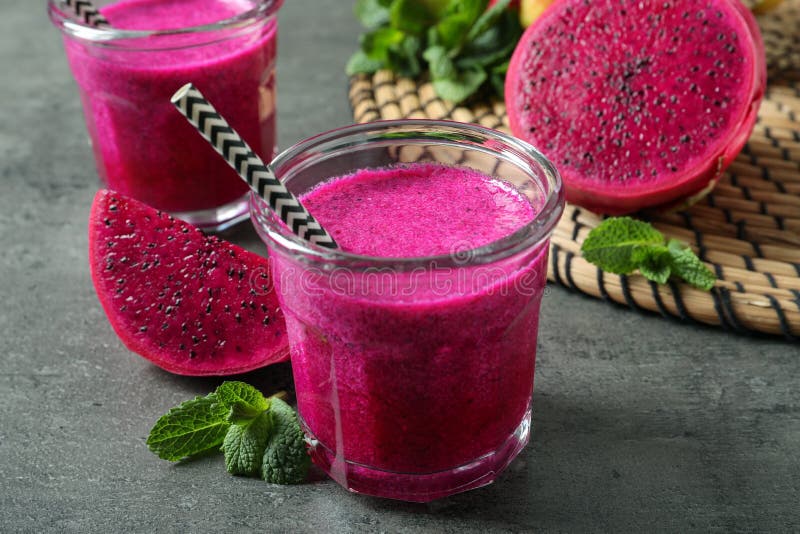 Delicious Pitahaya Smoothie, Fruits and Fresh Mint on Grey Table Stock ...