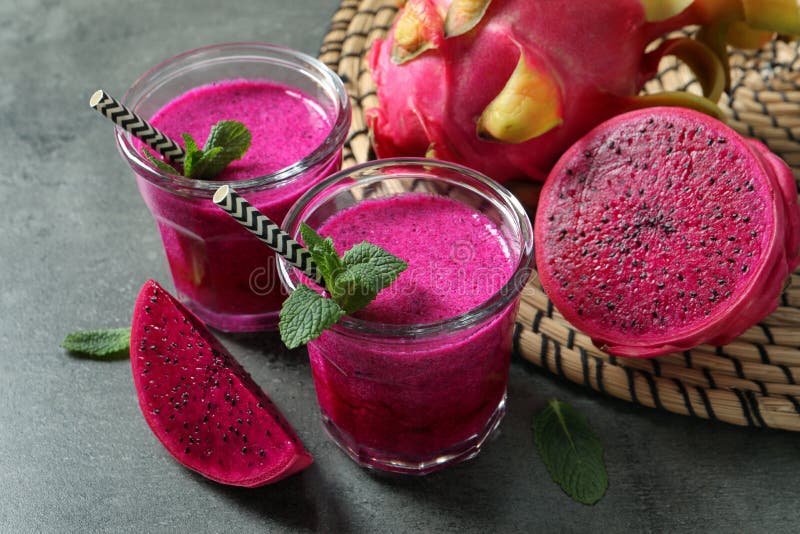 Delicious Pitahaya Smoothie, Fruits and Fresh Mint on Grey Table Stock ...