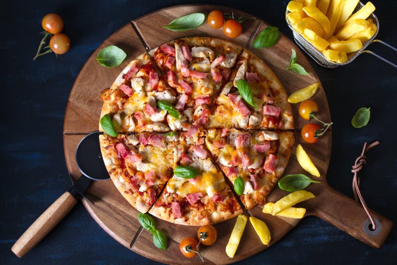 Delicious pizza and fries stock photo. Image of mozzarella 182657940