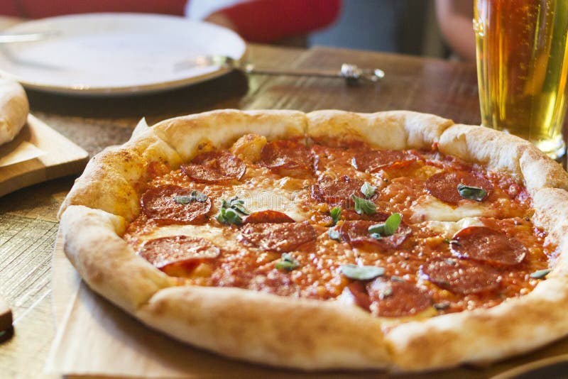 Delicious Pizza Served On Wooden Table Pizza In Restaurant Stock Image