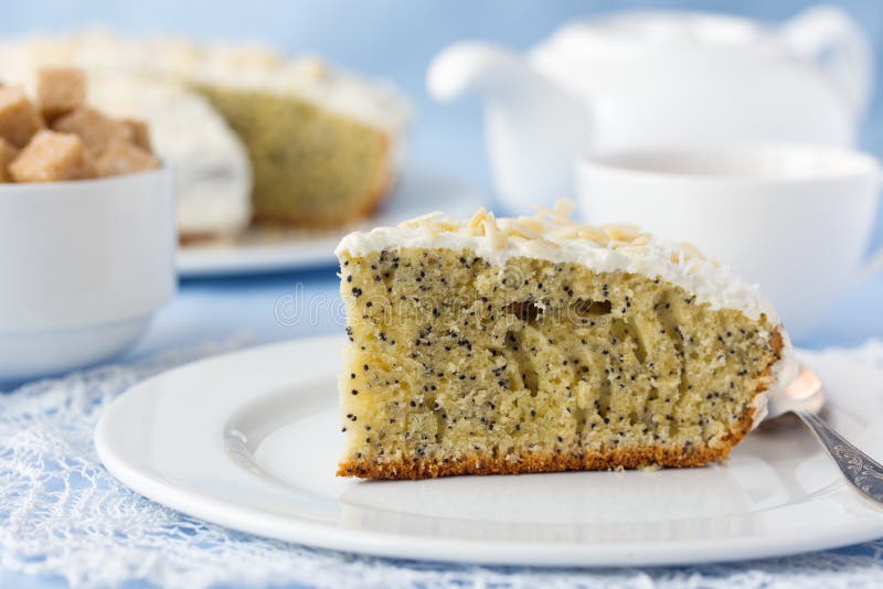 Delicious poppy seed cake with cup of tea on table stock photo Delicious poppy seed cake with cup of tea on table stock photo