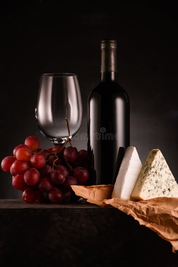 Delicious Red Wine with Grapes and Cheese on Black Stock Photo Image