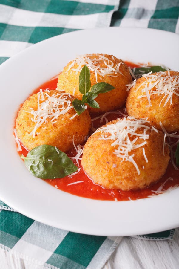 Delicious Rice Balls in Tomato Sauce on a Plate Close-up. Vertic Stock ...