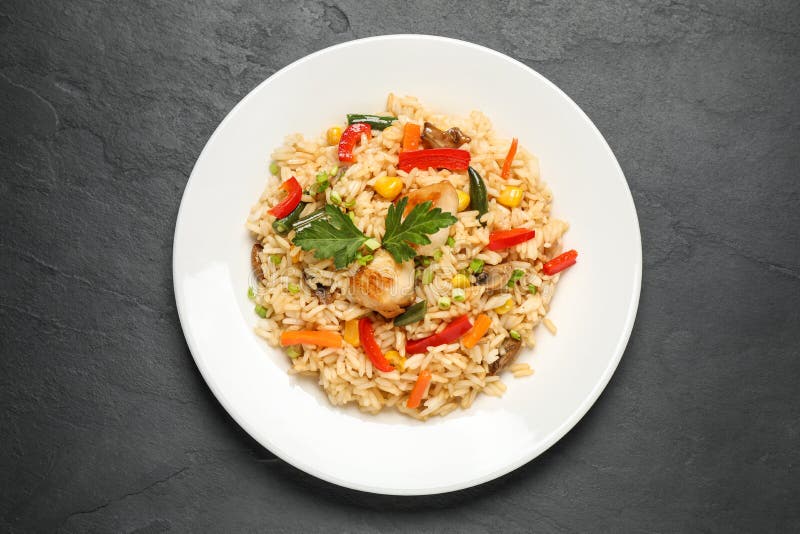 Delicious Rice Pilaf with Chicken and Vegetables on Table, Top View