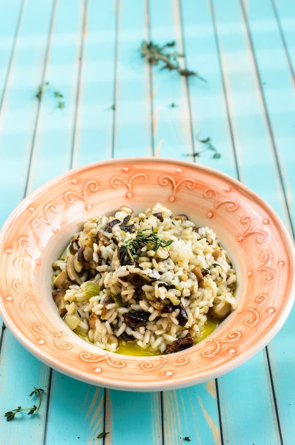 Delicious Risotto with Chanterelle Mushrooms Over Rustic Black ...