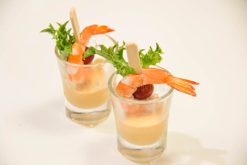 Shrimp cocktail in a minii glass with lettuce and sauce