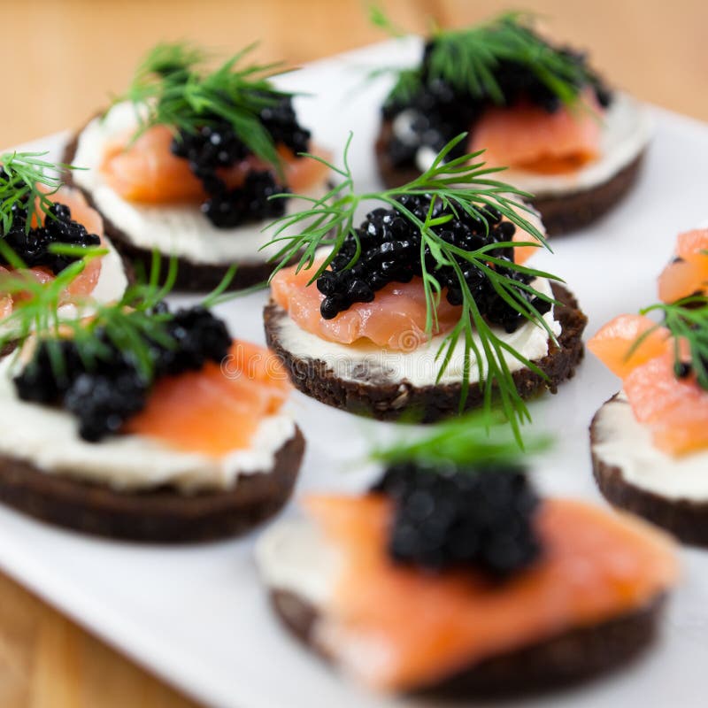 Delicious snack with salmon and caviar