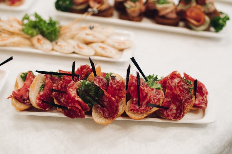 Delicious snacks with sausage on plate. stock image Delicious snacks with sausage on plate. stock image
