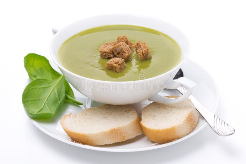 Delicious spinach soup with croutons, isolated