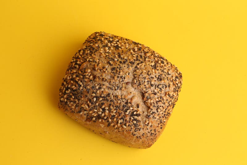 Delicious and Tasty Black Bread with Sesame Seeds on the Yellow Surface Stock Image Image of