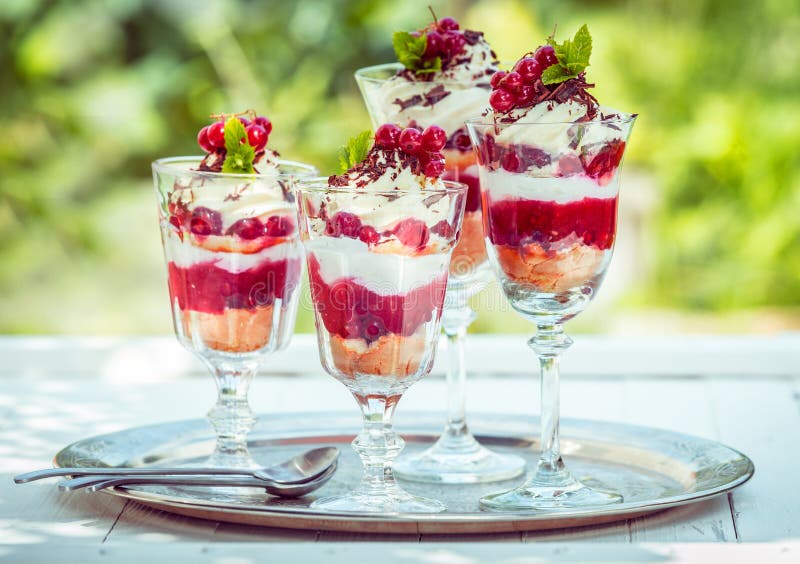 Delicous redcurrant sundaes or desserts served outdoors