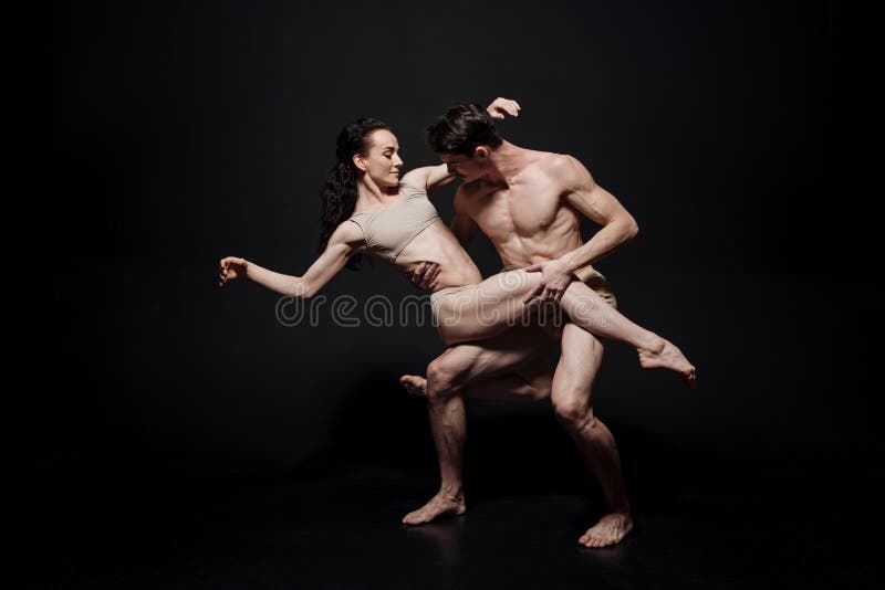 Delighted ballet dancers acting in the studio stock photography