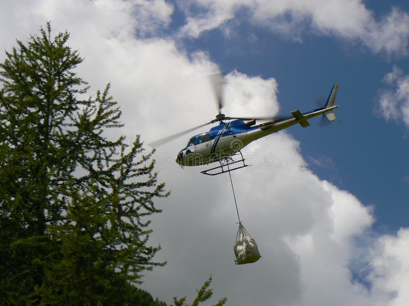 Delivery by helicopter stock photo. Image of helicopter 57711630