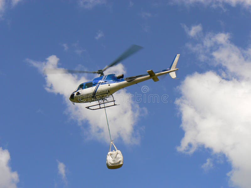 Delivery by helicopter stock image. Image of flying, emergency 57711763