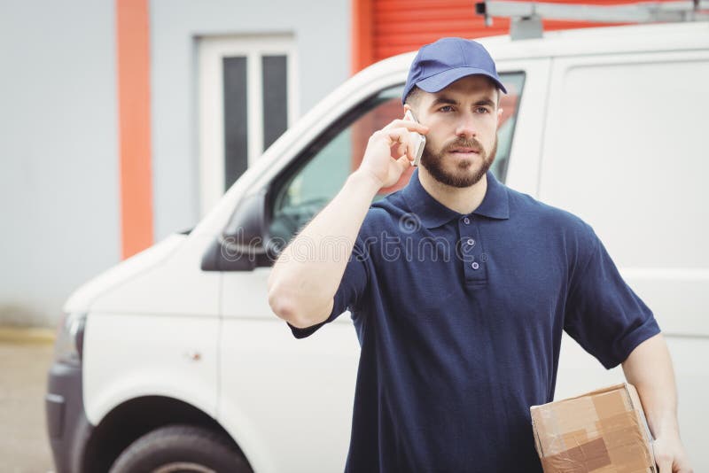Delivery Man Making a Phone Call Stock Photo Image of delivery