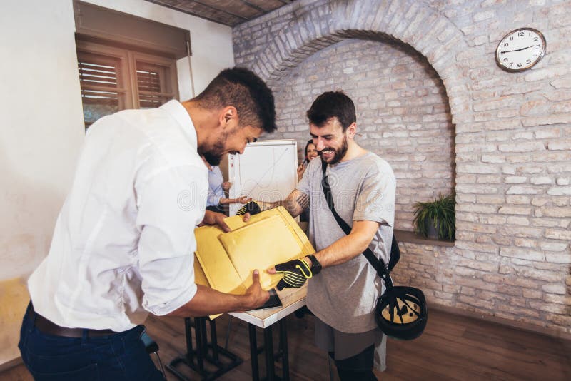 Delivery Man Package Delivery at Office Stock Photo - Image of express, deliver: 186383122
