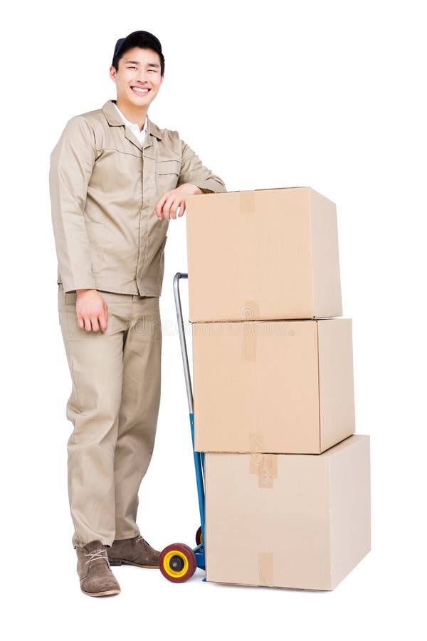 Delivery Man Standing beside Luggage Trolley with Cardboard Boxes Stock Image Image of service