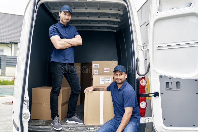 Delivery men at work stock image. Image of container 224812087