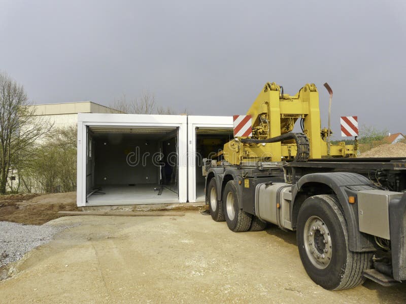 Delivery of a prefabricated garage on construction side royalty free stock photo