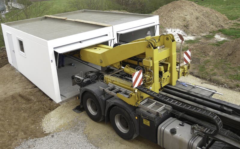 Delivery of a prefabricated garage on construction side royalty free stock photo