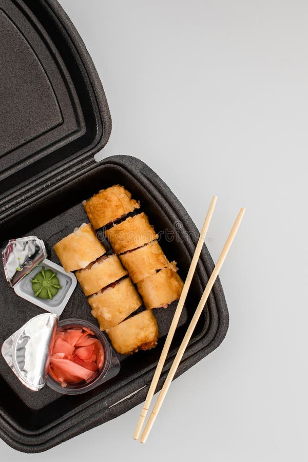 Delivery Service Japanese Food Rolls in Plastic Box. Copy Space Stock