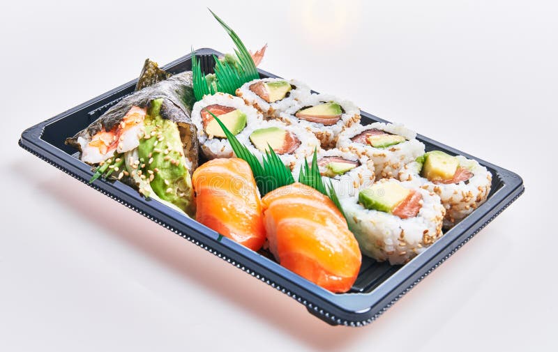 Delivery Tray of Delicious Sushi Over Isolated White Background Stock