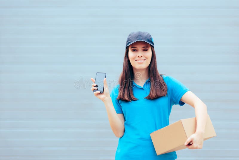 Delivery Woman Holding A Cardboard Package And A Smartphone Stock Photo
