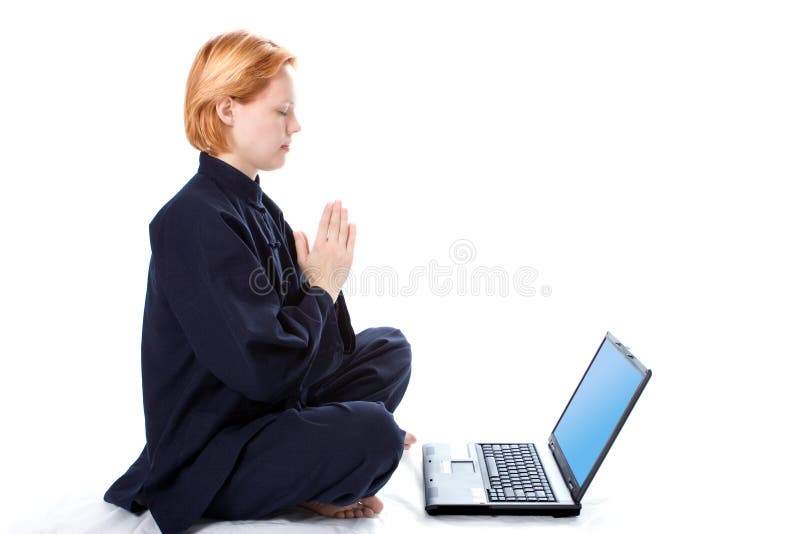 Young woman in kimono attend yoga with laptop on white background. Young woman in kimono attend yoga with laptop on white background