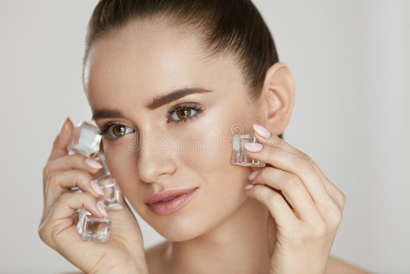 Beauty Treatment. Woman With Ice Cubes. Beautiful Girl Using Ice On Skin. High Quality. Beauty Treatment. Woman With Ice Cubes. Beautiful Girl Using Ice On Skin. High Quality