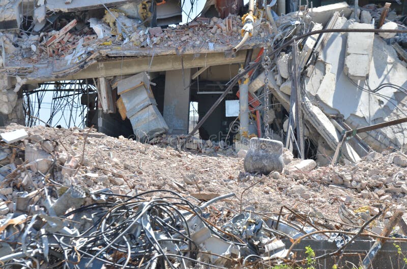 Ruins of a building being torn down with a wrecking ball. Ruins of a building being torn down with a wrecking ball