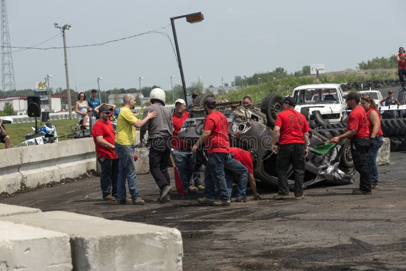 Napierville demolition derby, July 12, 2015, picture of driver out of the wrecked car during demolition derby. Driver banging stock images, royalty-free photos and pictures