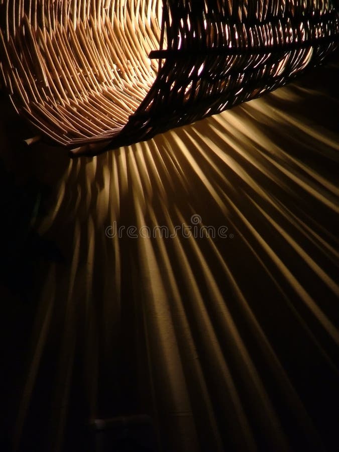 Handmade twig lamp on the wall, casting interesting shadows. Handmade twig lamp on the wall, casting interesting shadows