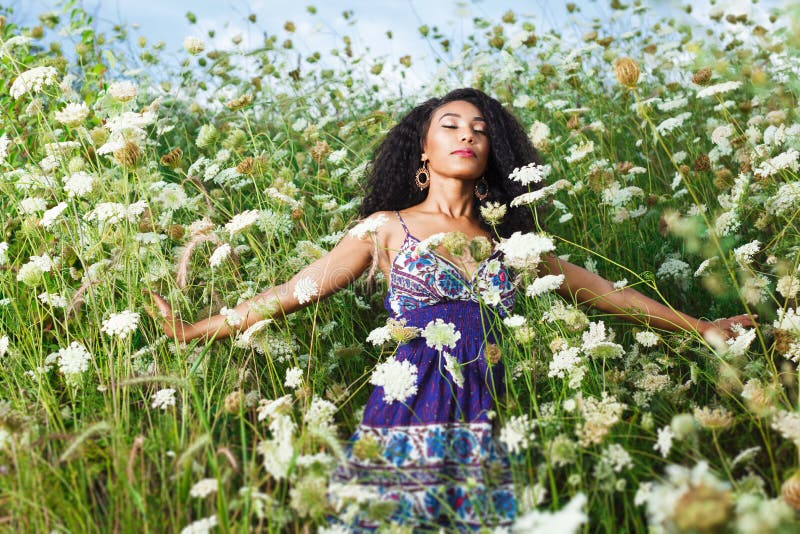 Young beautiful African American girl enjoys summer day. Young beautiful African American girl enjoys summer day.